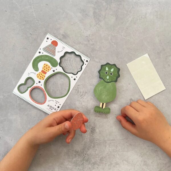 Press out shapes to build a dino peg doll