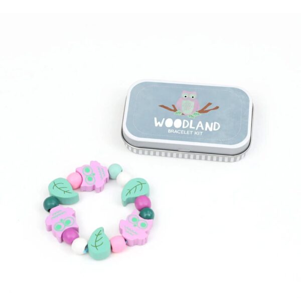 Craft tin containing materials to make a wooden bead woodland-themed bracelet